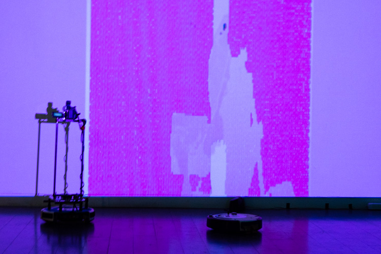 two robots manipulate projection